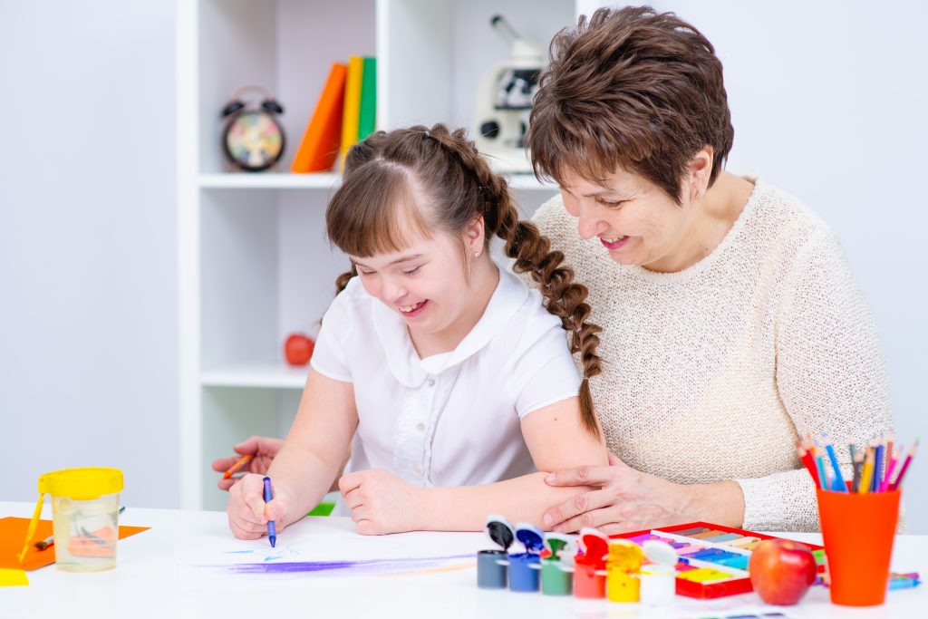A support worker helping someone in their own home.